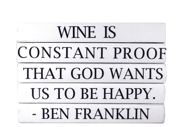 "WINE IS CONSTANT PROOF THAT GOD WANTS US TO BE HAPPY." Quote Book Stack